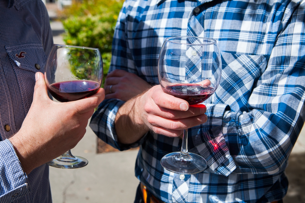 Couple of dudes drinking wine